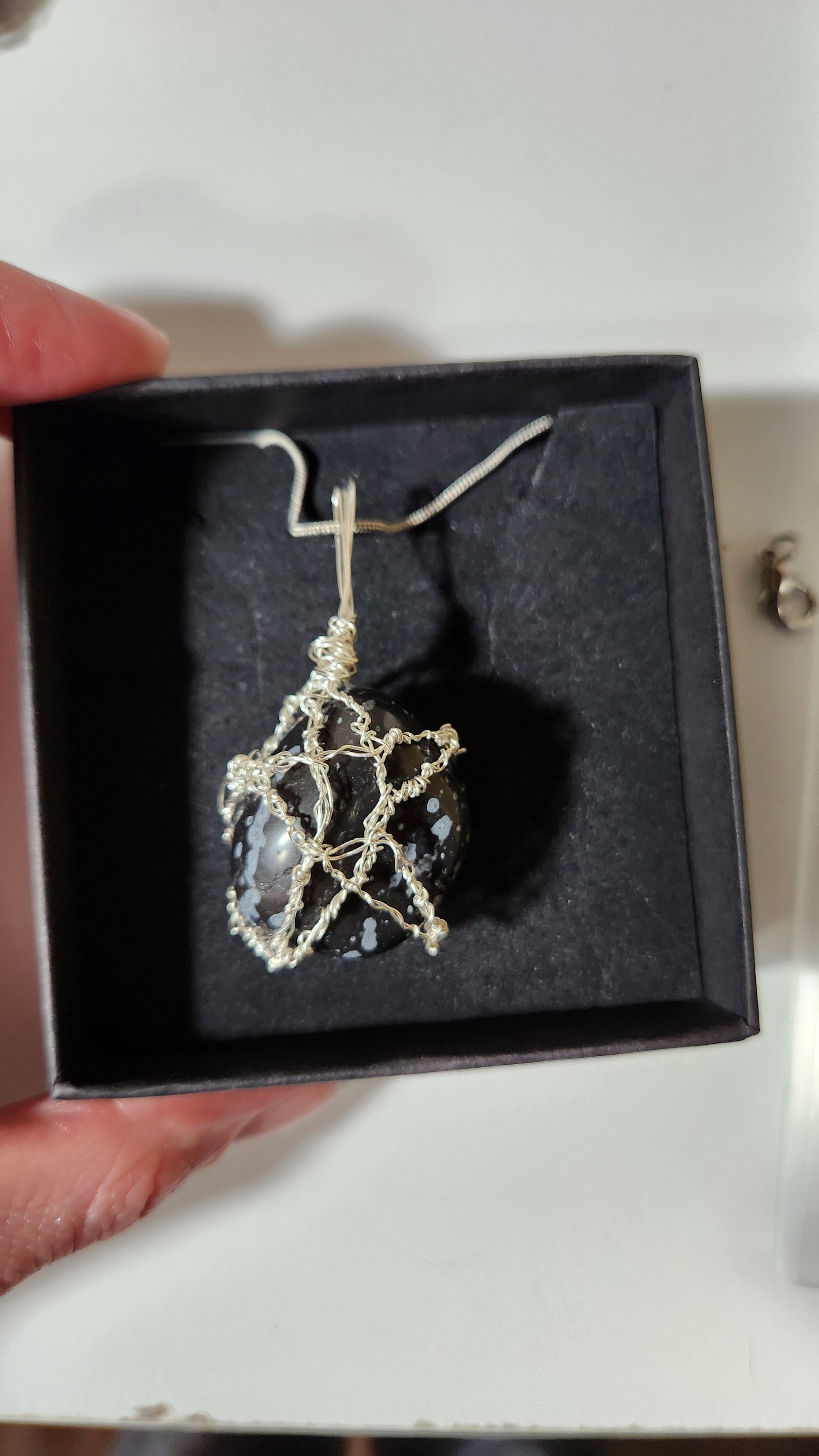 Snowflake Obsidian Star necklace.